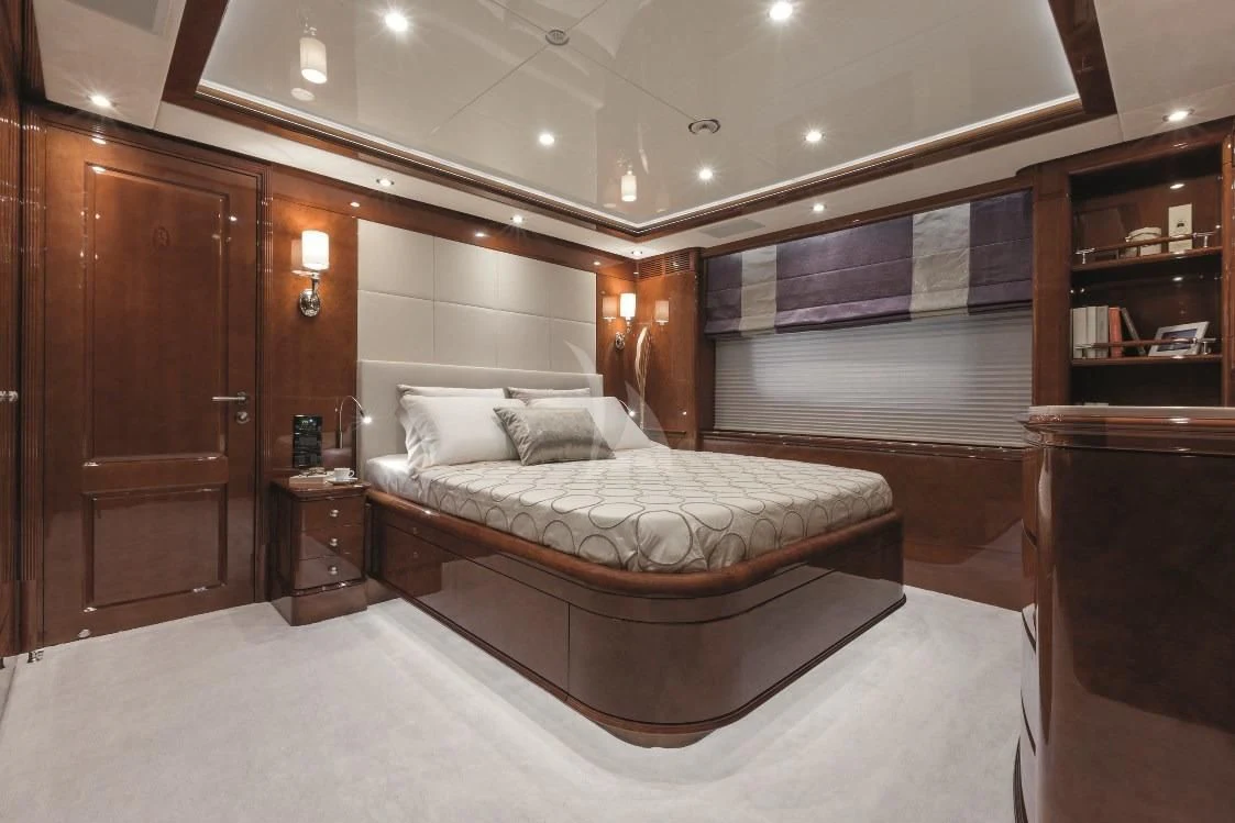 a large bedroom with a large bed aboard CHECKMATE Yacht for Charter