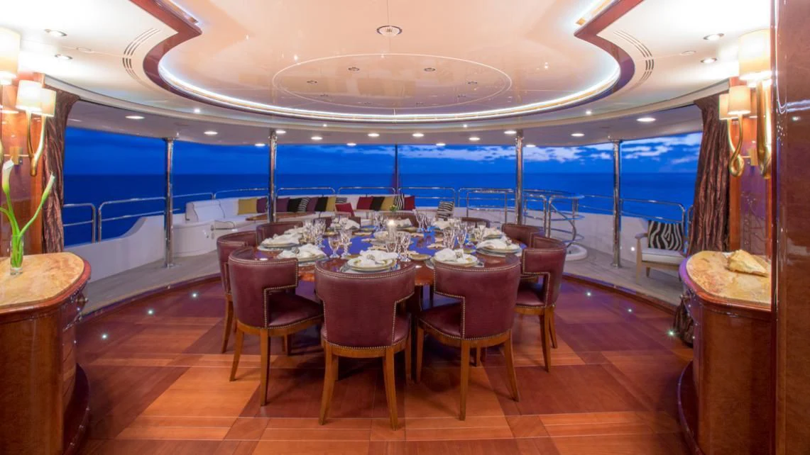 a dining room with a table and chairs aboard CHECKMATE Yacht for Charter