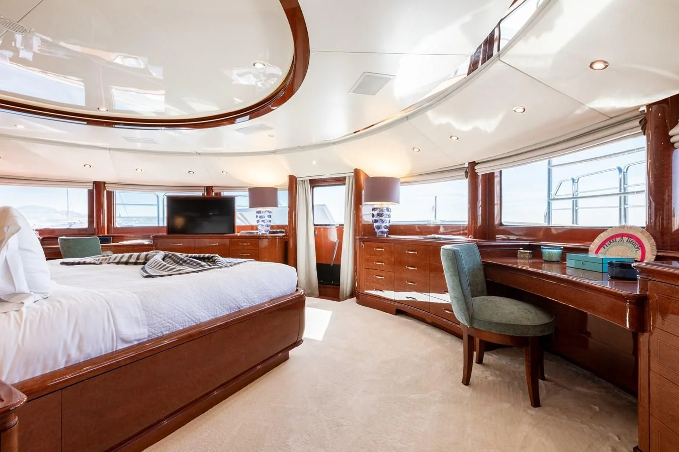 a bedroom with a bed and desk aboard CHECKMATE Yacht for Charter