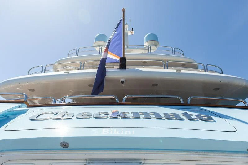 a row of white and blue boats aboard CHECKMATE Yacht for Charter