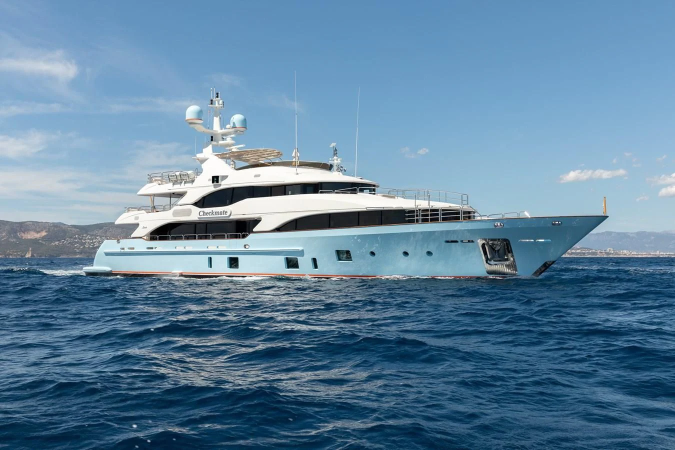 a large white boat in the water aboard CHECKMATE Yacht for Charter