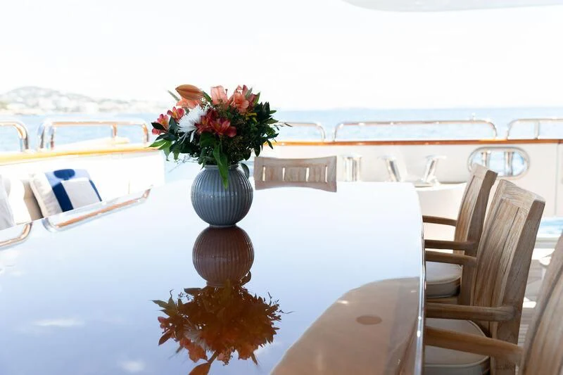 a vase of flowers on a table aboard CHECKMATE Yacht for Charter