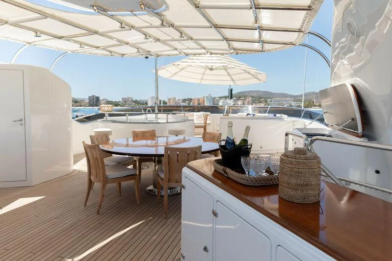 a kitchen with a table and chairs aboard CHECKMATE Yacht for Charter