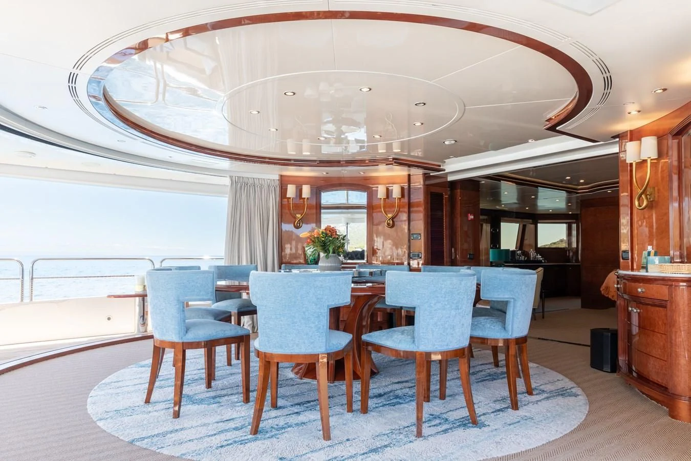 a large room with a table and chairs aboard CHECKMATE Yacht for Charter