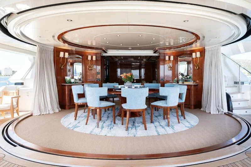 a large dining room with a large table and chairs aboard CHECKMATE Yacht for Charter