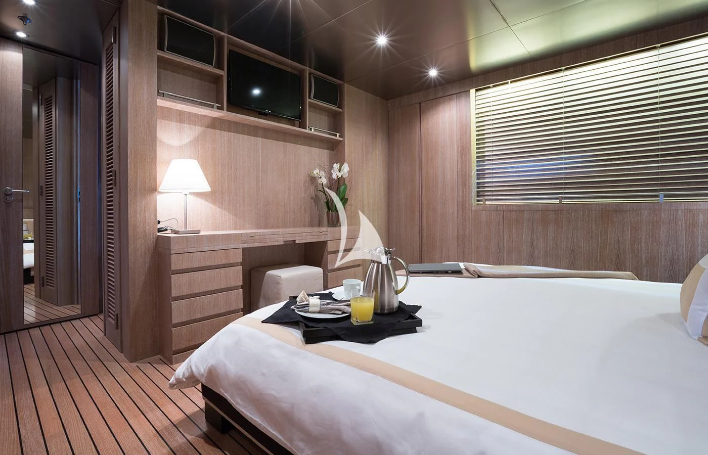 a room with a bed and a table aboard MARIU Yacht for Sale