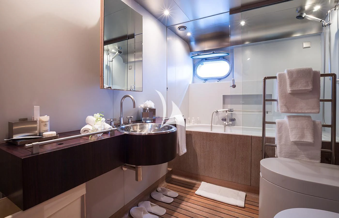a bathroom with a sink and a mirror aboard MARIU Yacht for Sale