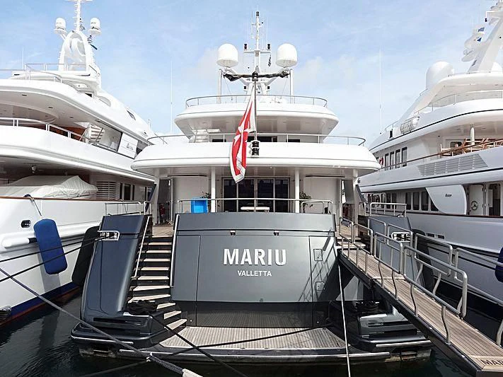a boat docked at a pier aboard MARIU Yacht for Sale