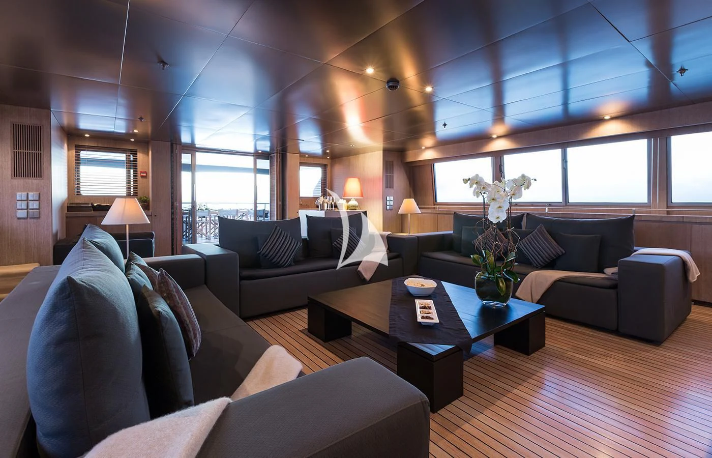 a living room with a couch and a coffee table aboard MARIU Yacht for Sale