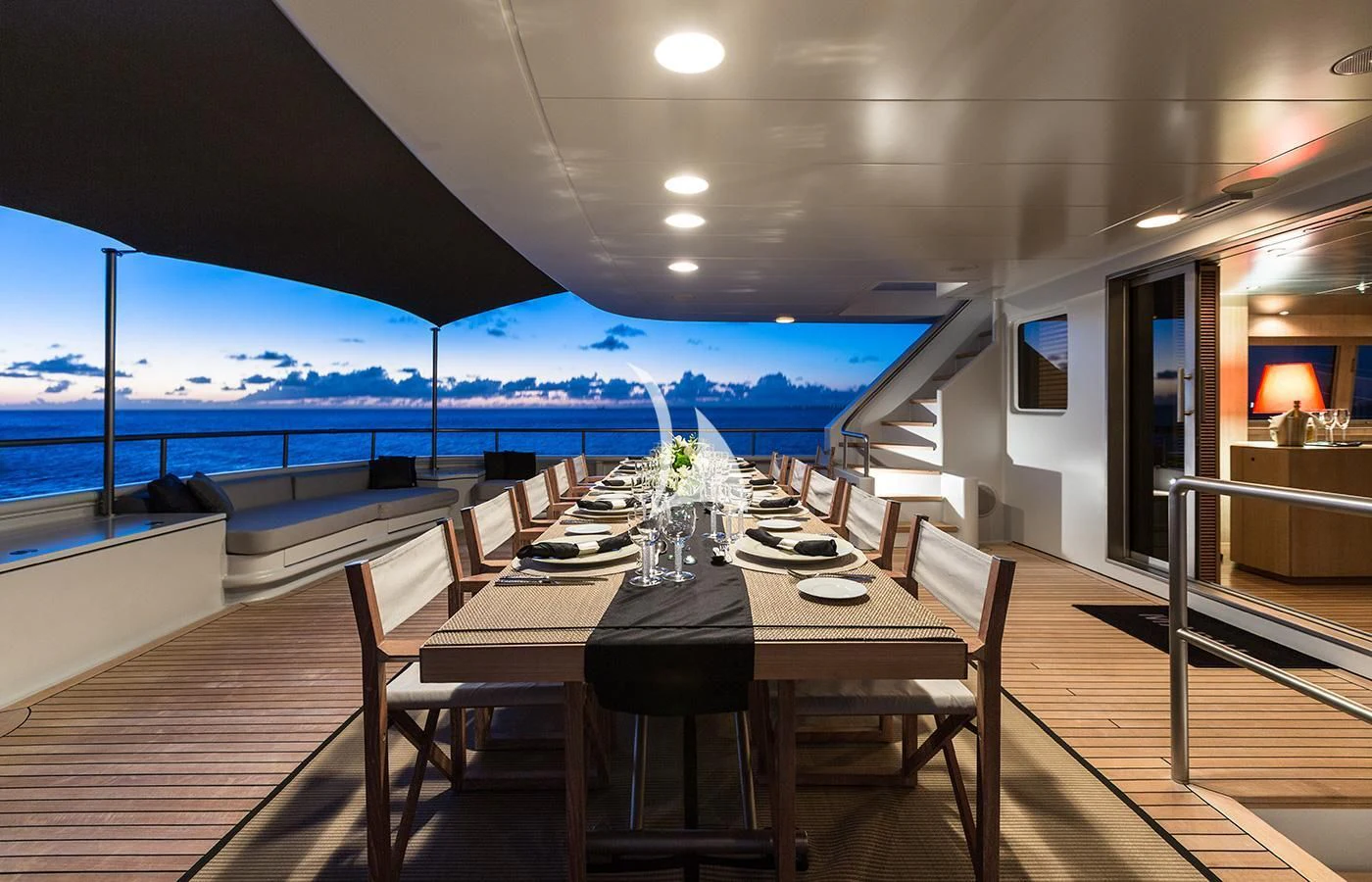 a table and chairs on a deck aboard MARIU Yacht for Sale