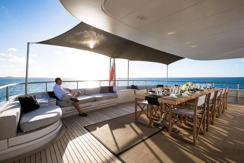 a person sitting on a couch on a boat aboard MARIU Yacht for Sale