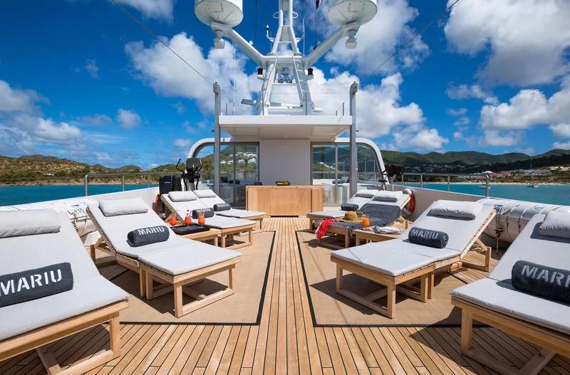 a deck with a deck and a boat on it aboard MARIU Yacht for Sale