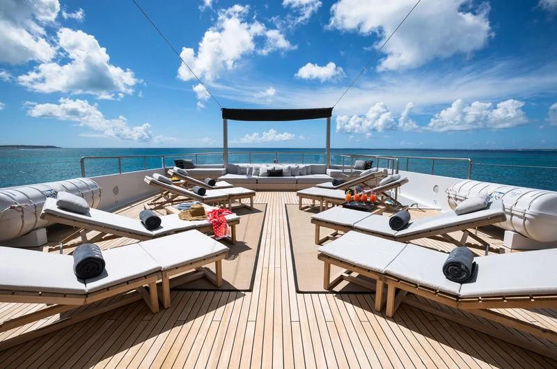 a deck with several white boats aboard MARIU Yacht for Sale