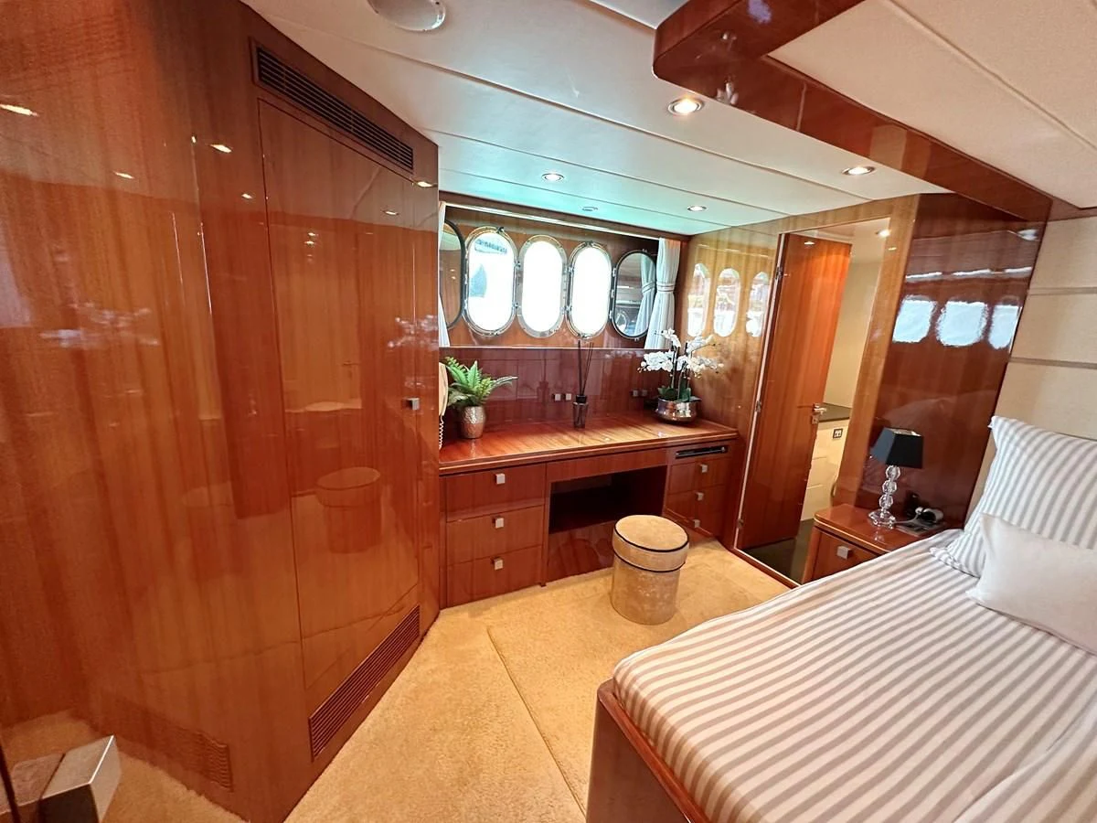 a room with a bed and a desk aboard ESPRESSO Yacht for Sale
