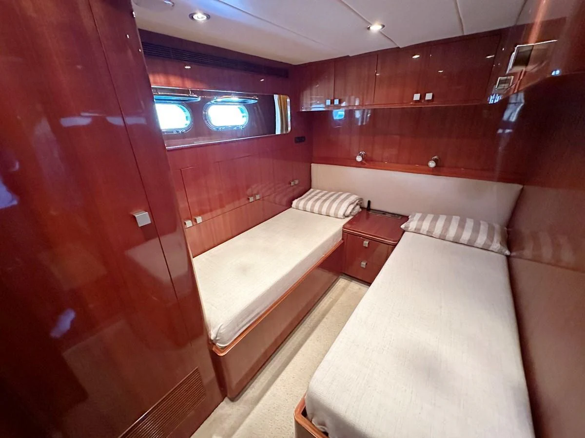 a room with a bed and a couch aboard ESPRESSO Yacht for Sale