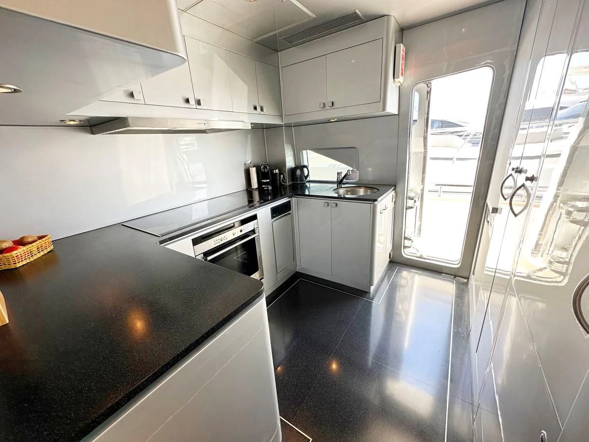 a kitchen with white cabinets aboard ESPRESSO Yacht for Sale