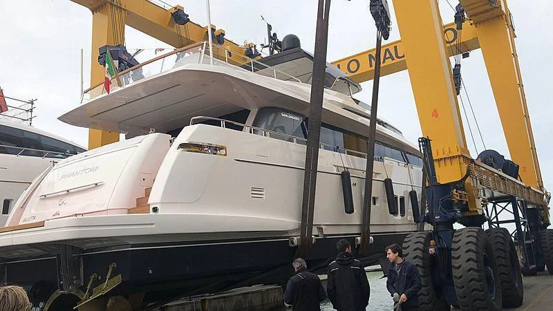 a large white boat with a large flat bed on the front aboard PHANTOM Yacht for Sale