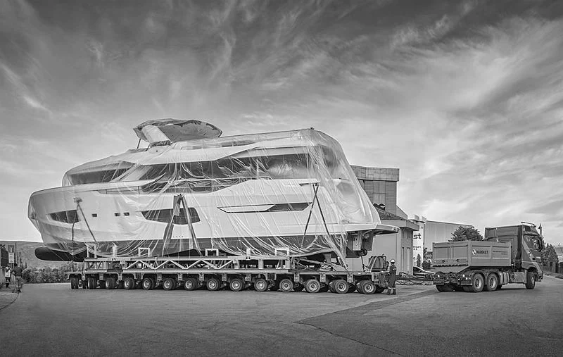 a large tank parked in front of a building aboard BADE Yacht for Sale