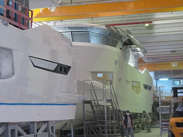 a large airplane in a hangar aboard BADE Yacht for Sale