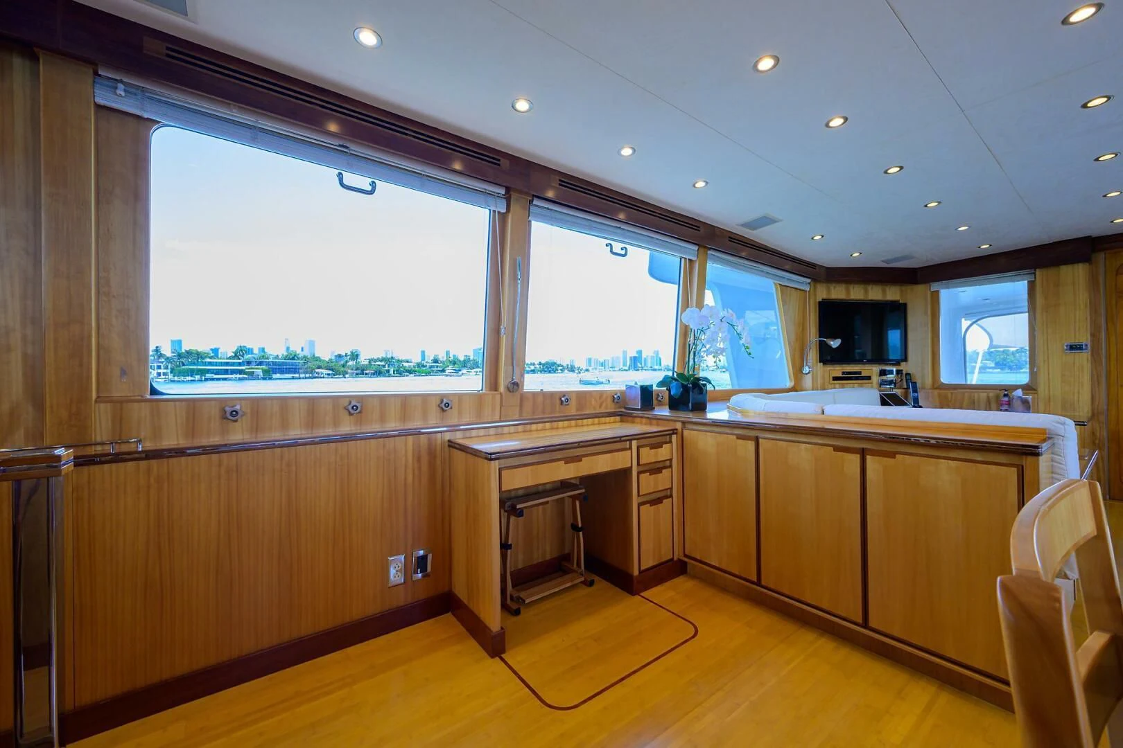 a kitchen with wooden cabinets aboard ELECTRA Yacht for Sale