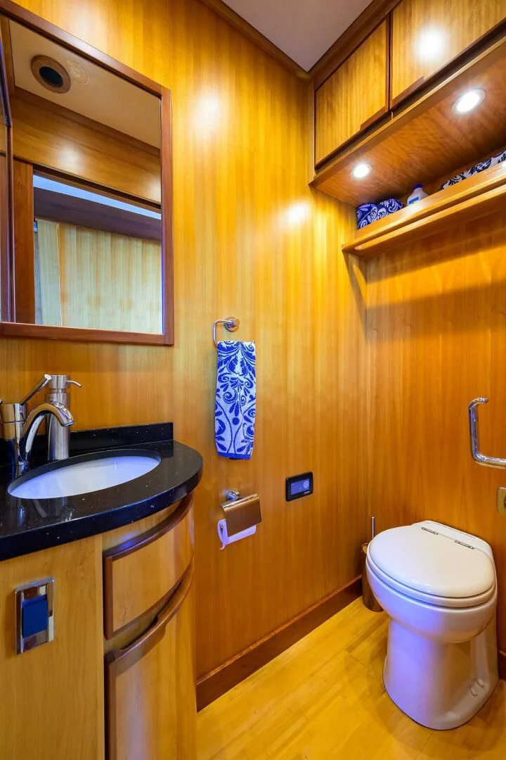 a bathroom with wooden walls aboard ELECTRA Yacht for Sale