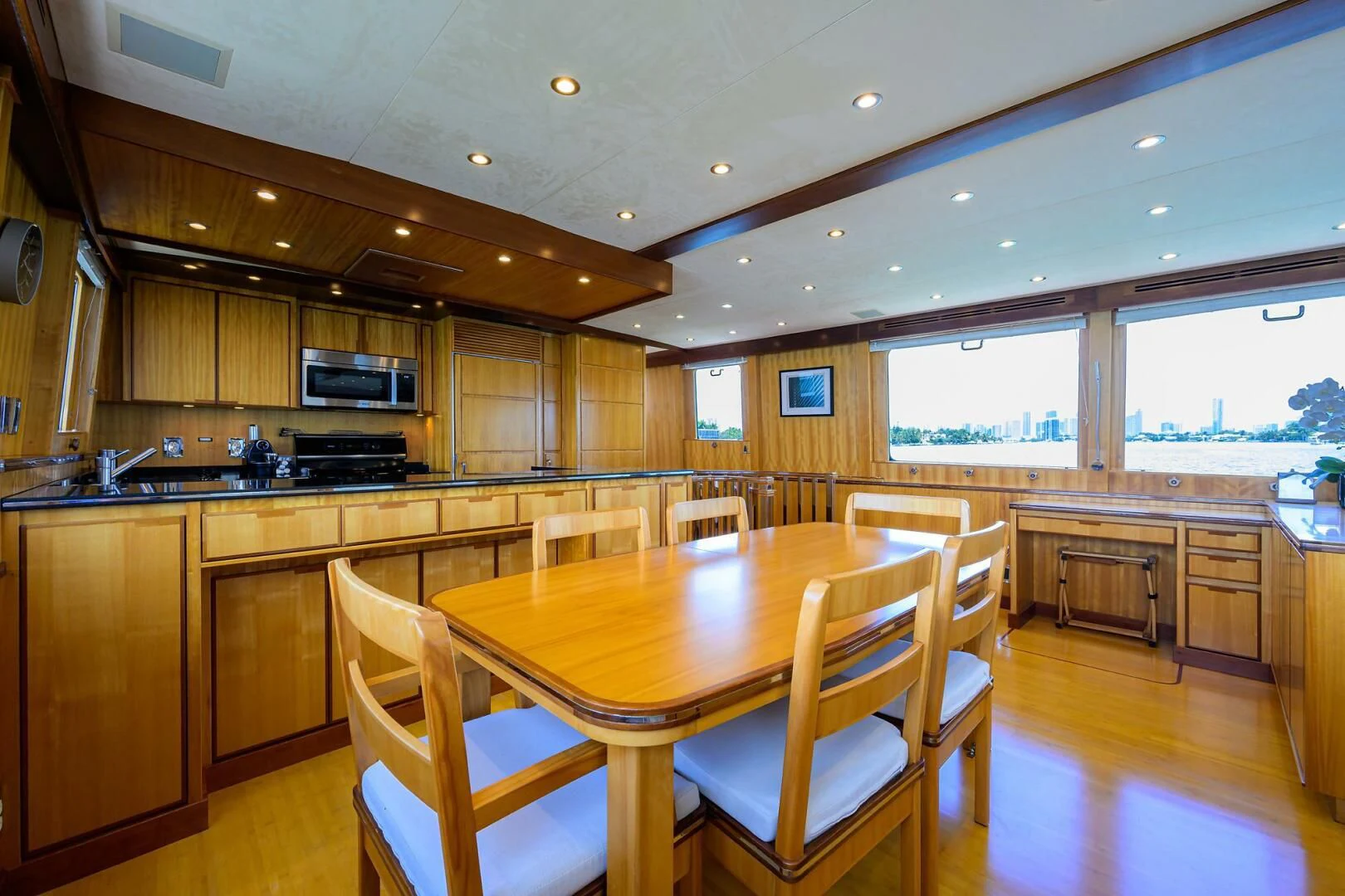 a kitchen with wooden cabinets aboard ELECTRA Yacht for Sale