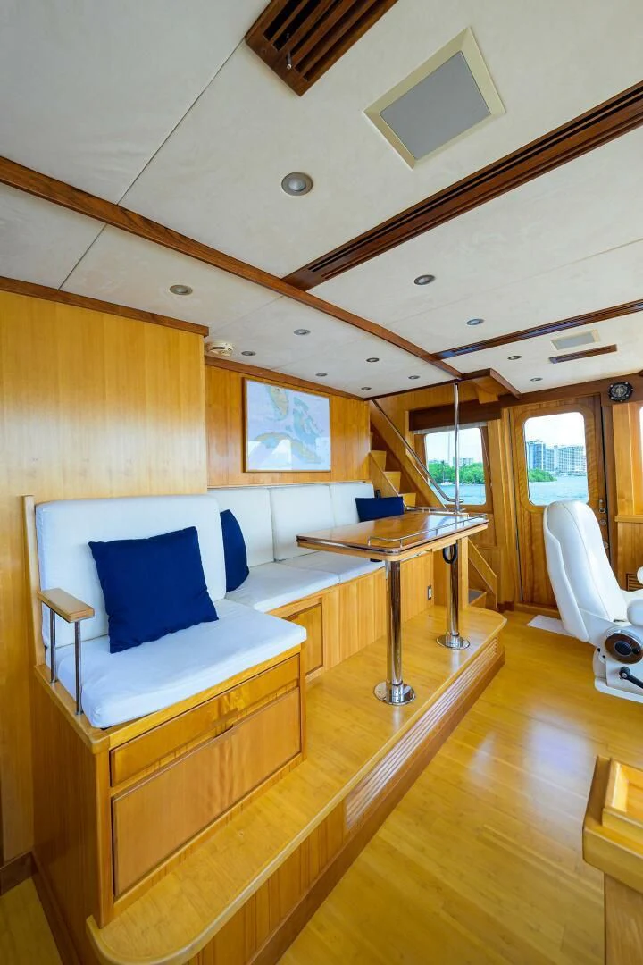 a room with a bed and a table aboard ELECTRA Yacht for Sale
