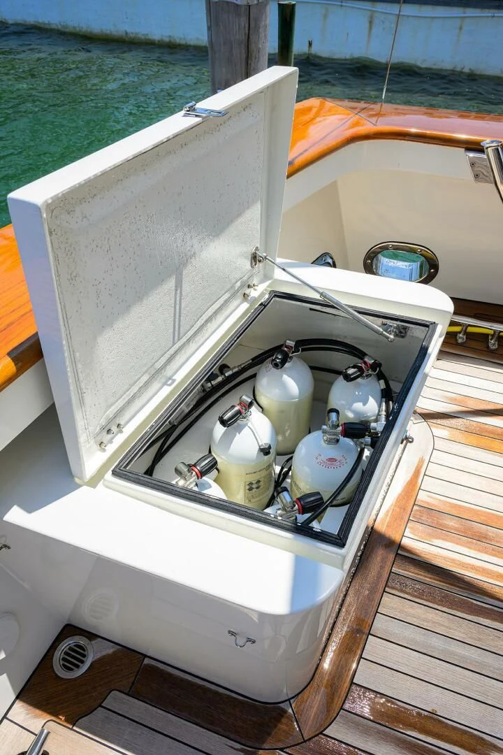 a white box with a bottle and a bucket on it aboard ELECTRA Yacht for Sale