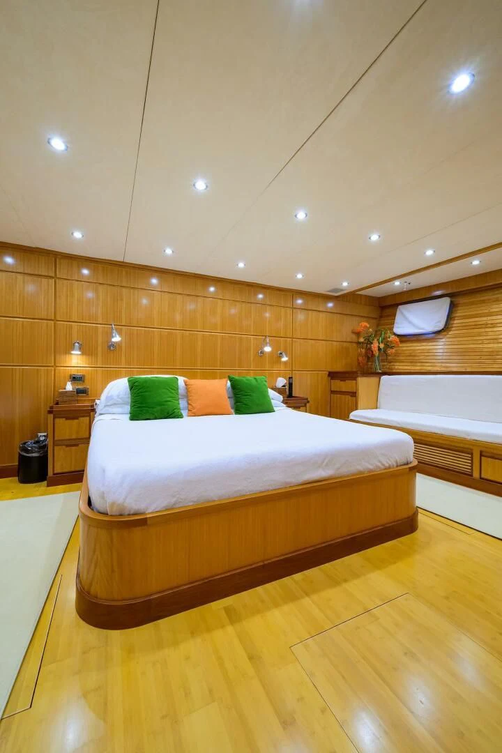 a room with a bed and a wood wall aboard ELECTRA Yacht for Sale