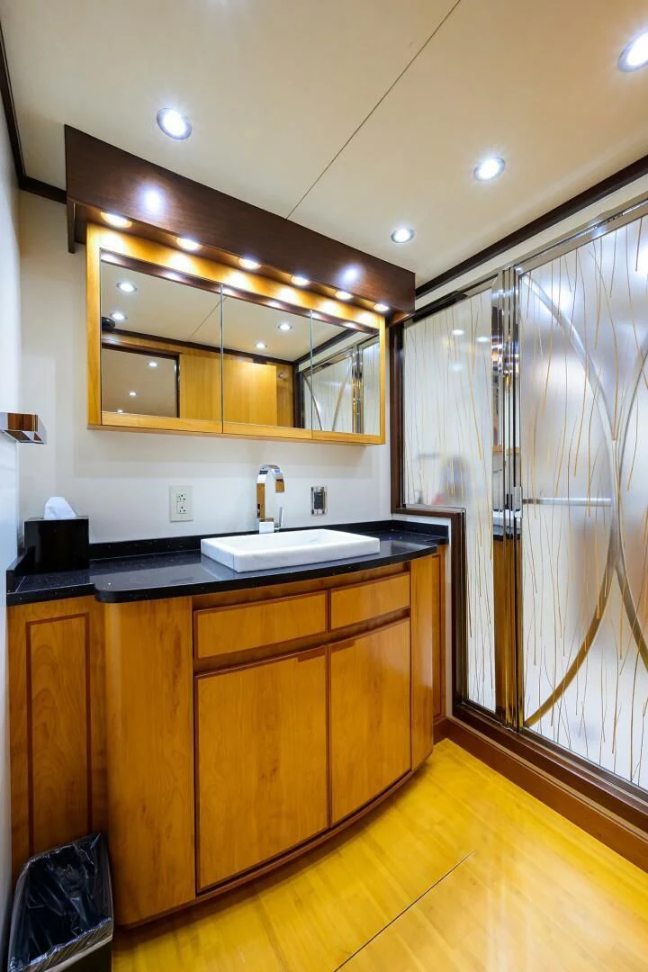 a bathroom with a sink and a mirror aboard ELECTRA Yacht for Sale