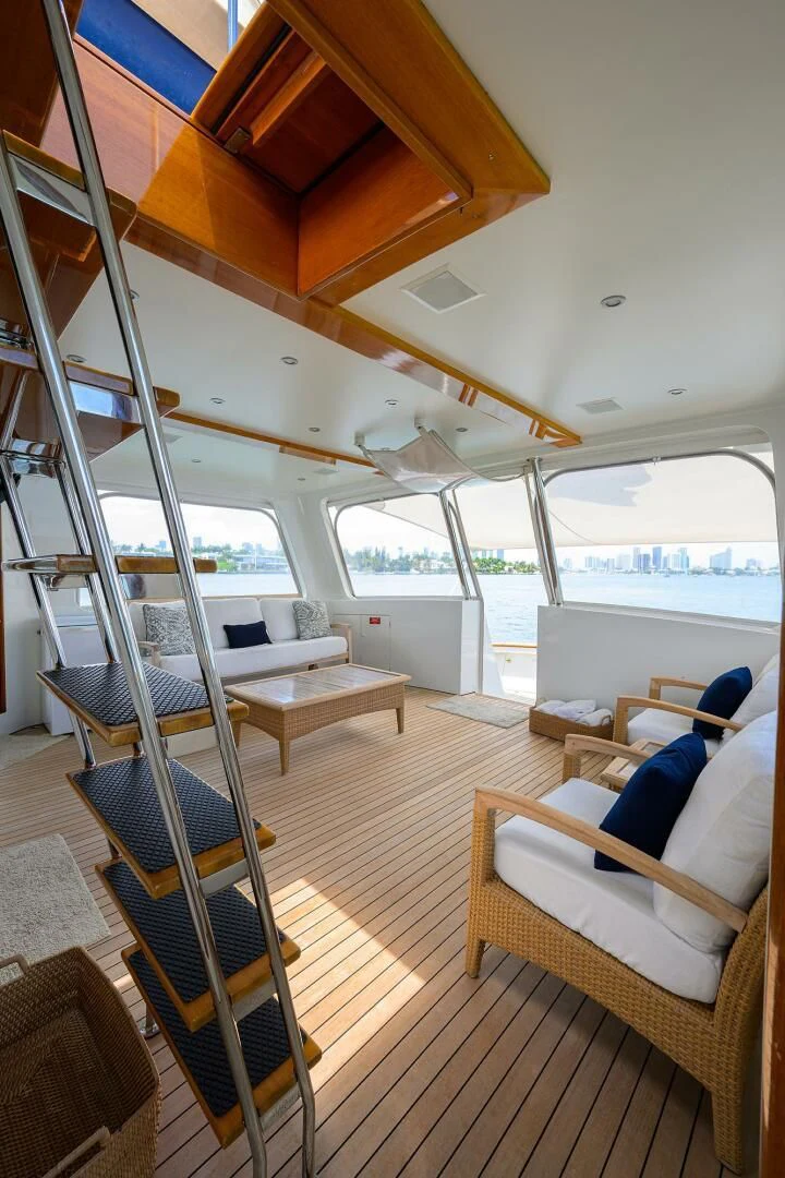 a room with a large window and a wood floor aboard ELECTRA Yacht for Sale