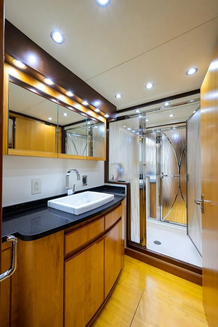 a bathroom with a sink and a shower unit aboard ELECTRA Yacht for Sale