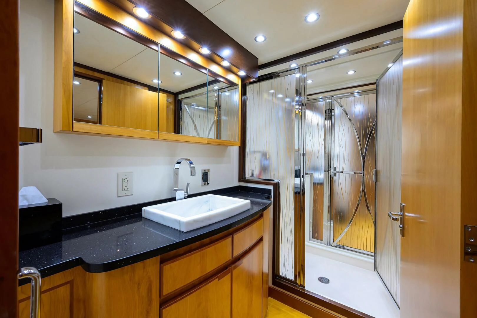 a bathroom with a large mirror aboard ELECTRA Yacht for Sale