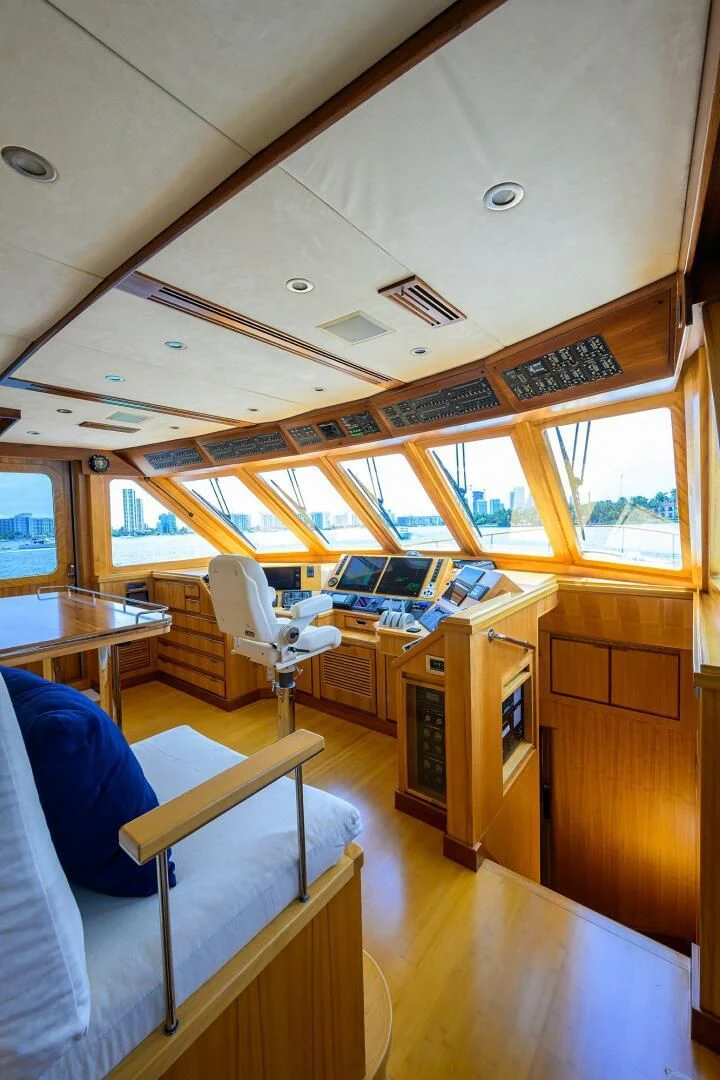 a room with a bed and desk aboard ELECTRA Yacht for Sale