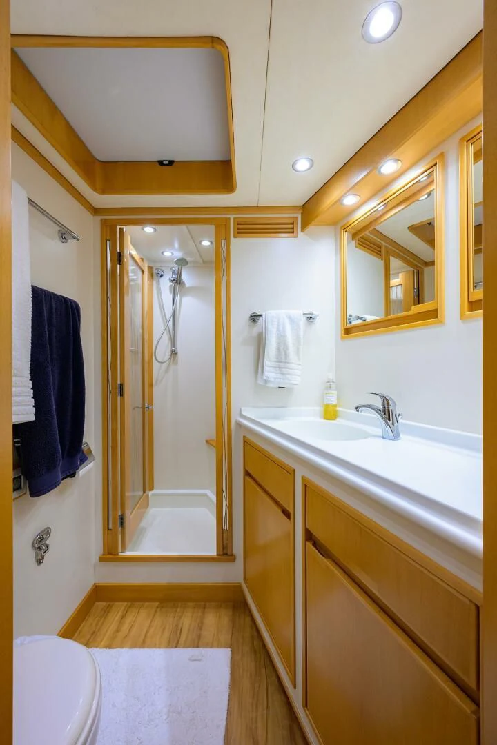 a bathroom with a shower and sink aboard ELECTRA Yacht for Sale