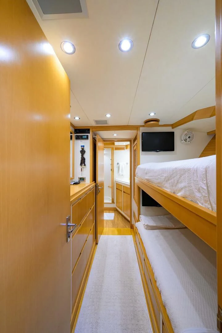 a room with a bed and a television aboard ELECTRA Yacht for Sale