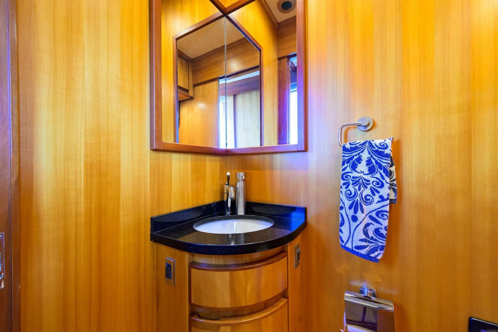 a bathroom with a sink and mirror aboard ELECTRA Yacht for Sale