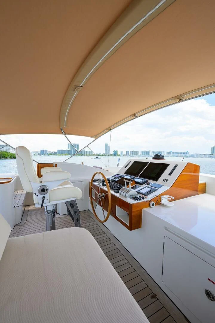 a boat with a desk and a laptop on it aboard ELECTRA Yacht for Sale