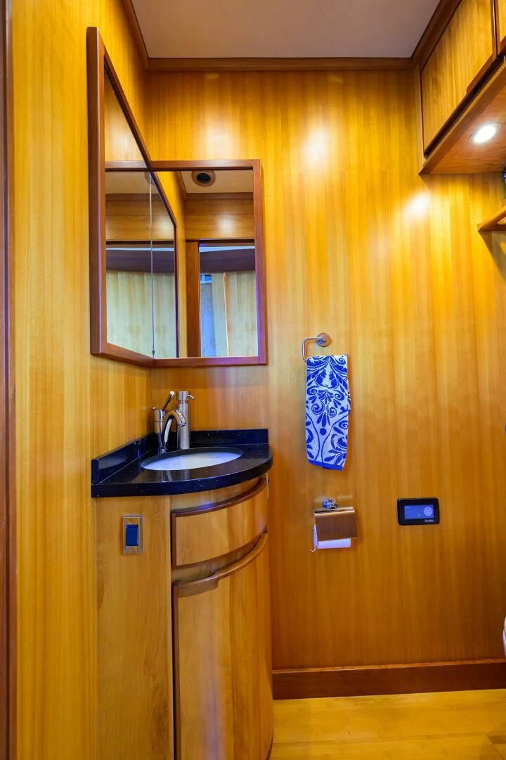 a bathroom with a sink and a mirror aboard ELECTRA Yacht for Sale