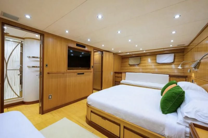 a room with a bed and a tv aboard ELECTRA Yacht for Sale