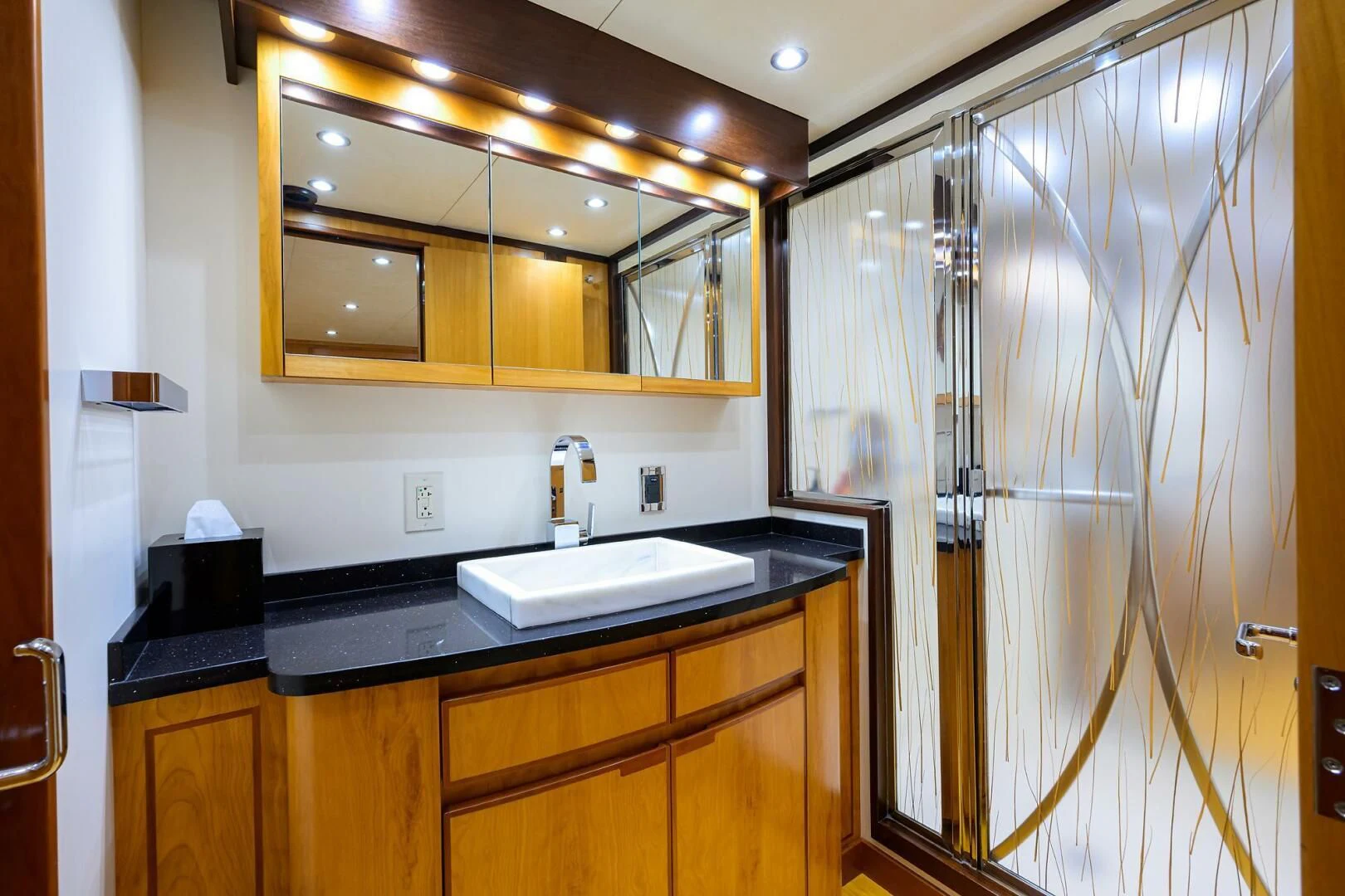 a bathroom with a shower unit and sink aboard ELECTRA Yacht for Sale