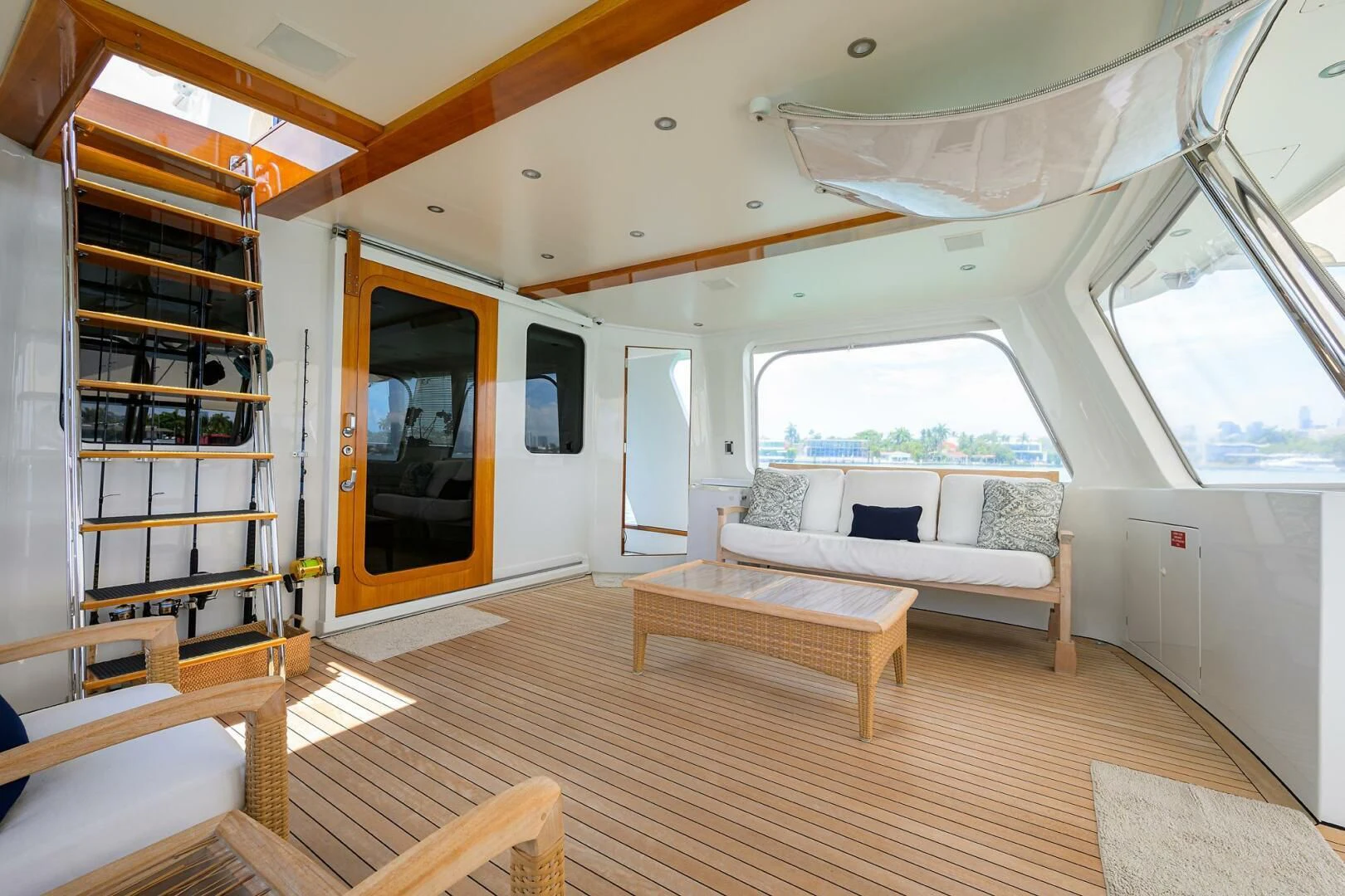 a room with a wood floor and a large window aboard ELECTRA Yacht for Sale