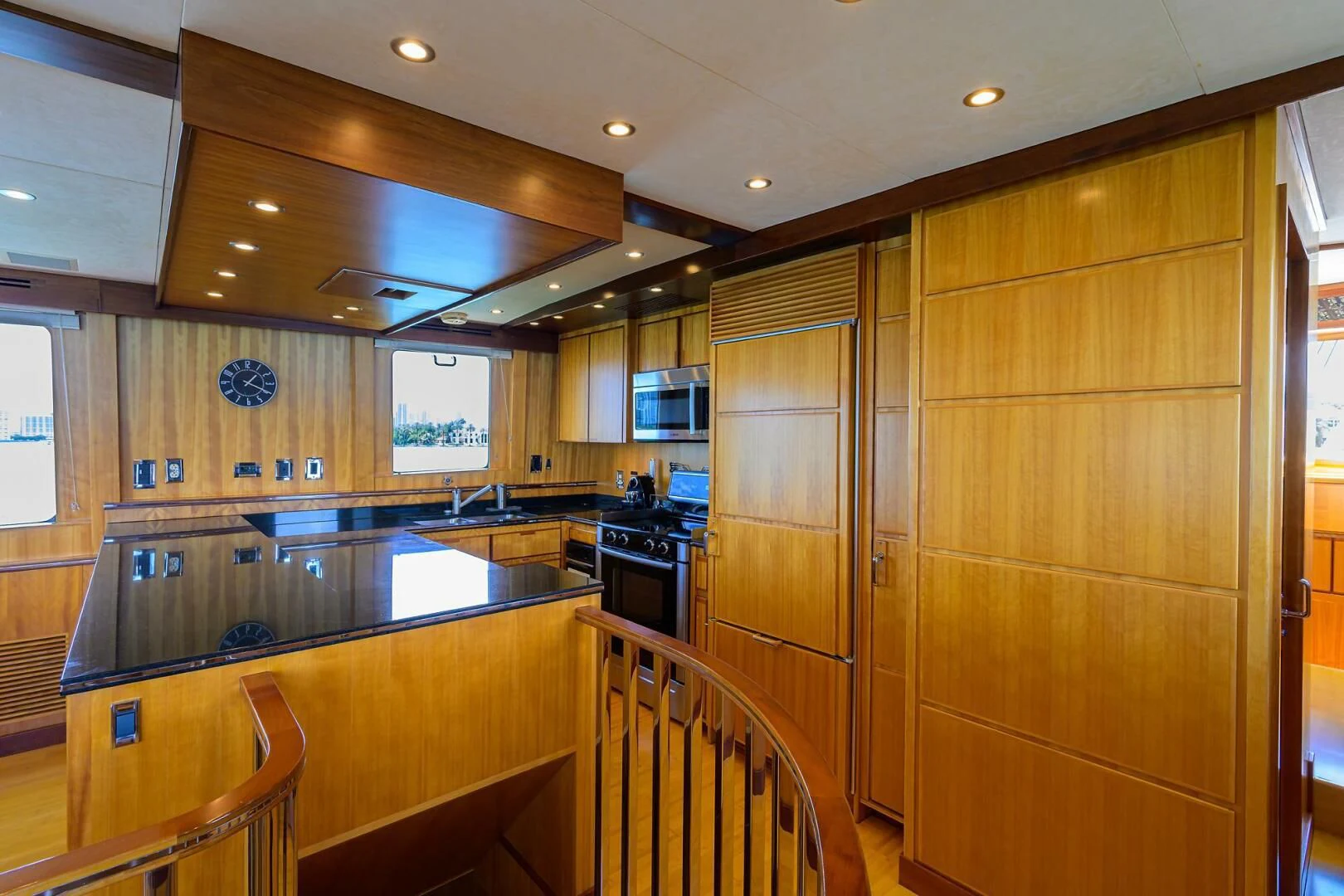 a kitchen with wooden cabinets aboard ELECTRA Yacht for Sale
