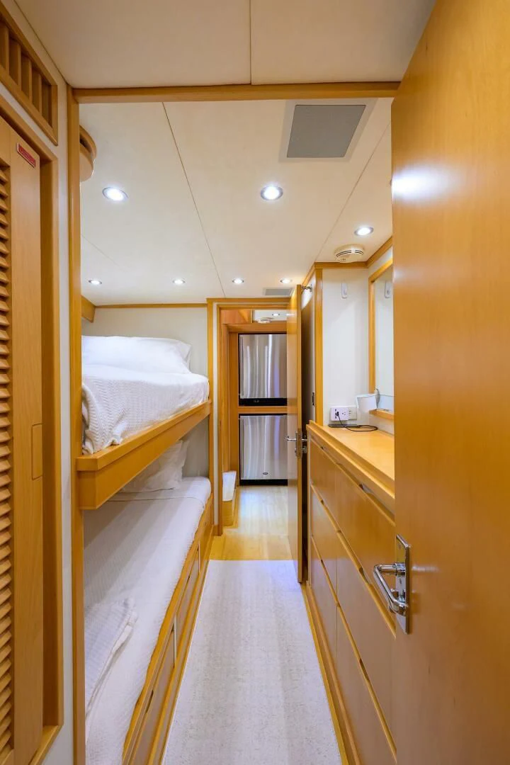 a room with a couple of beds aboard ELECTRA Yacht for Sale