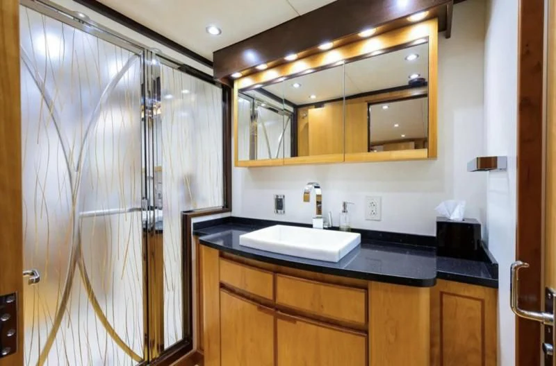 a bathroom with a sink and a mirror aboard ELECTRA Yacht for Sale