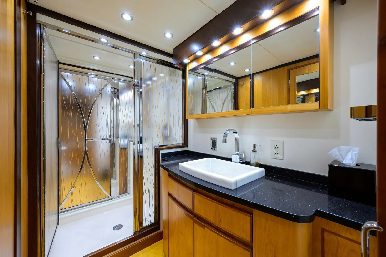 a bathroom with a large mirror aboard ELECTRA Yacht for Sale