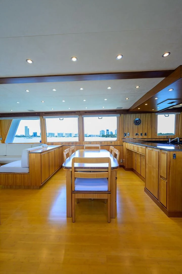 a wooden table in a kitchen aboard ELECTRA Yacht for Sale