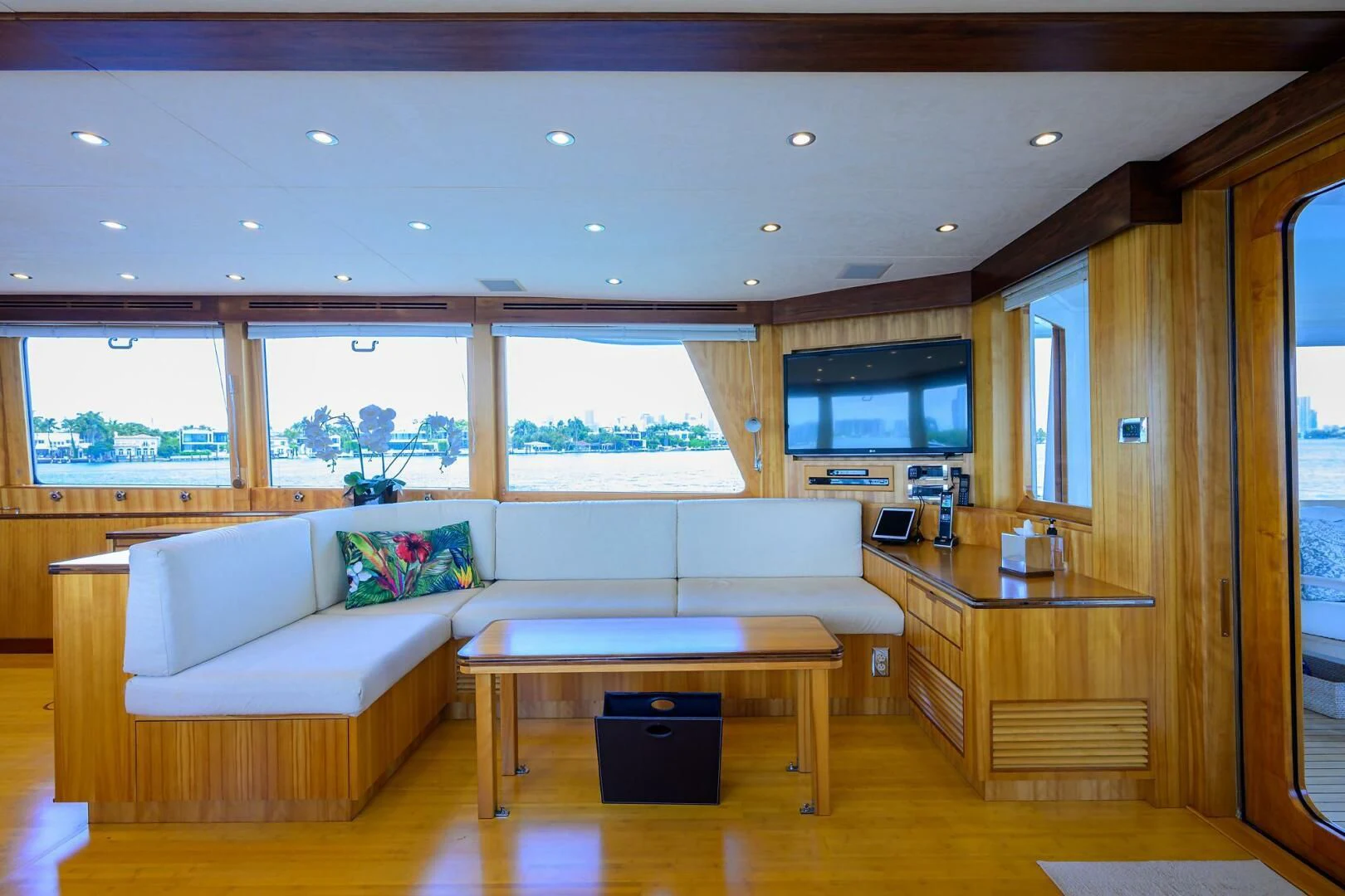 a living room with a couch and a coffee table aboard ELECTRA Yacht for Sale