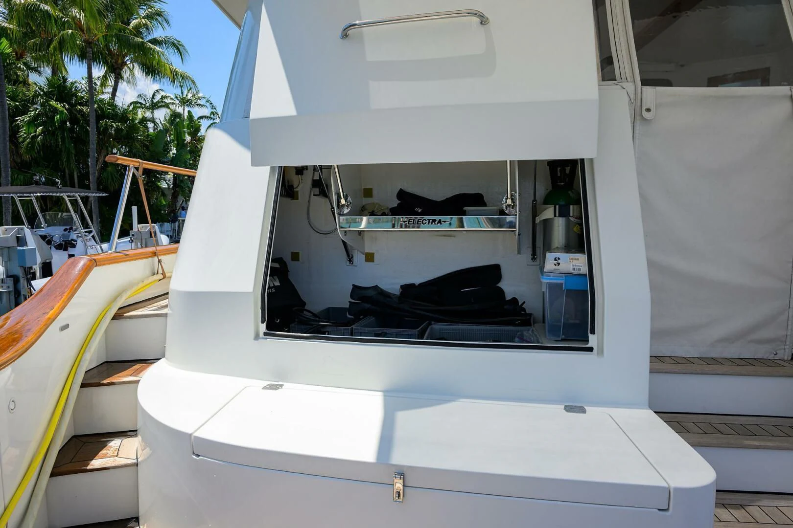 a white machine with a black object on the side aboard ELECTRA Yacht for Sale