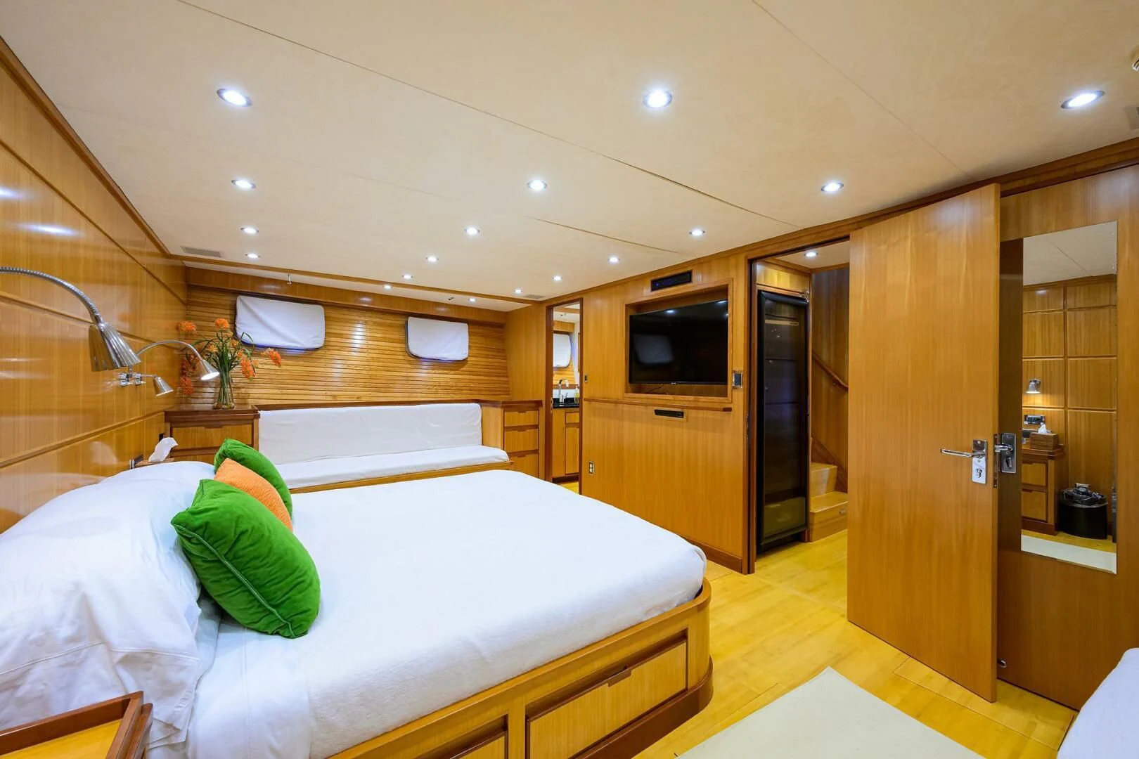 a bedroom with a bed and a tv aboard ELECTRA Yacht for Sale